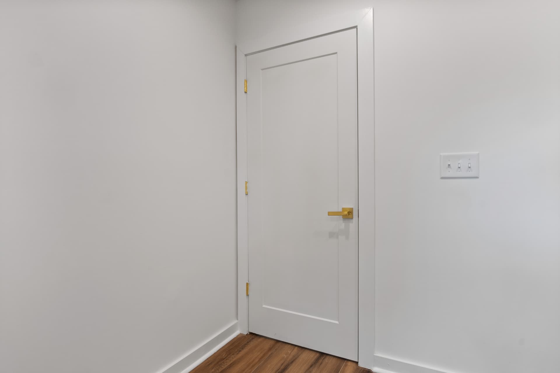 Hallway door and hardwood flooring