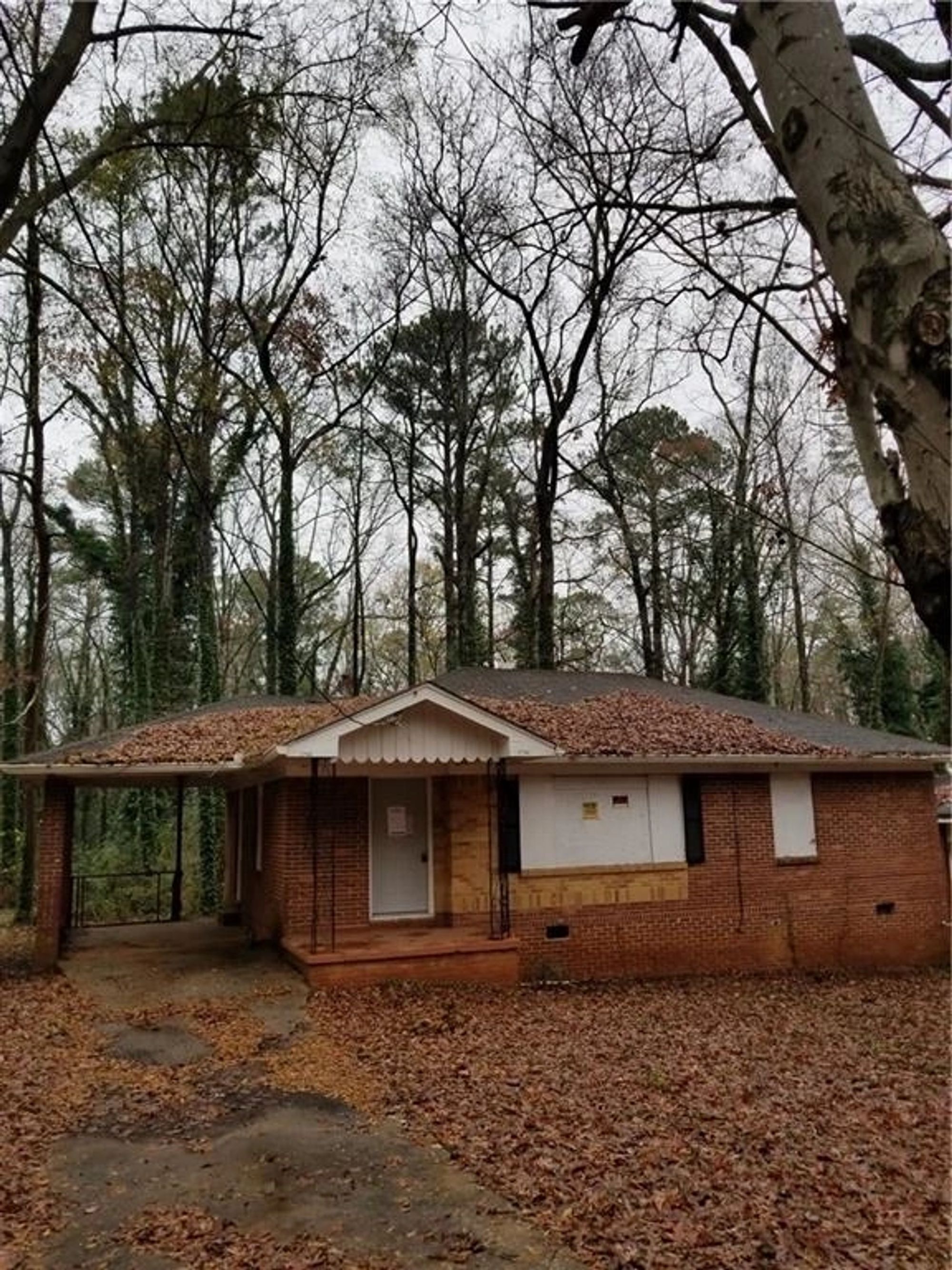 Original brick ranch exterior before renovation