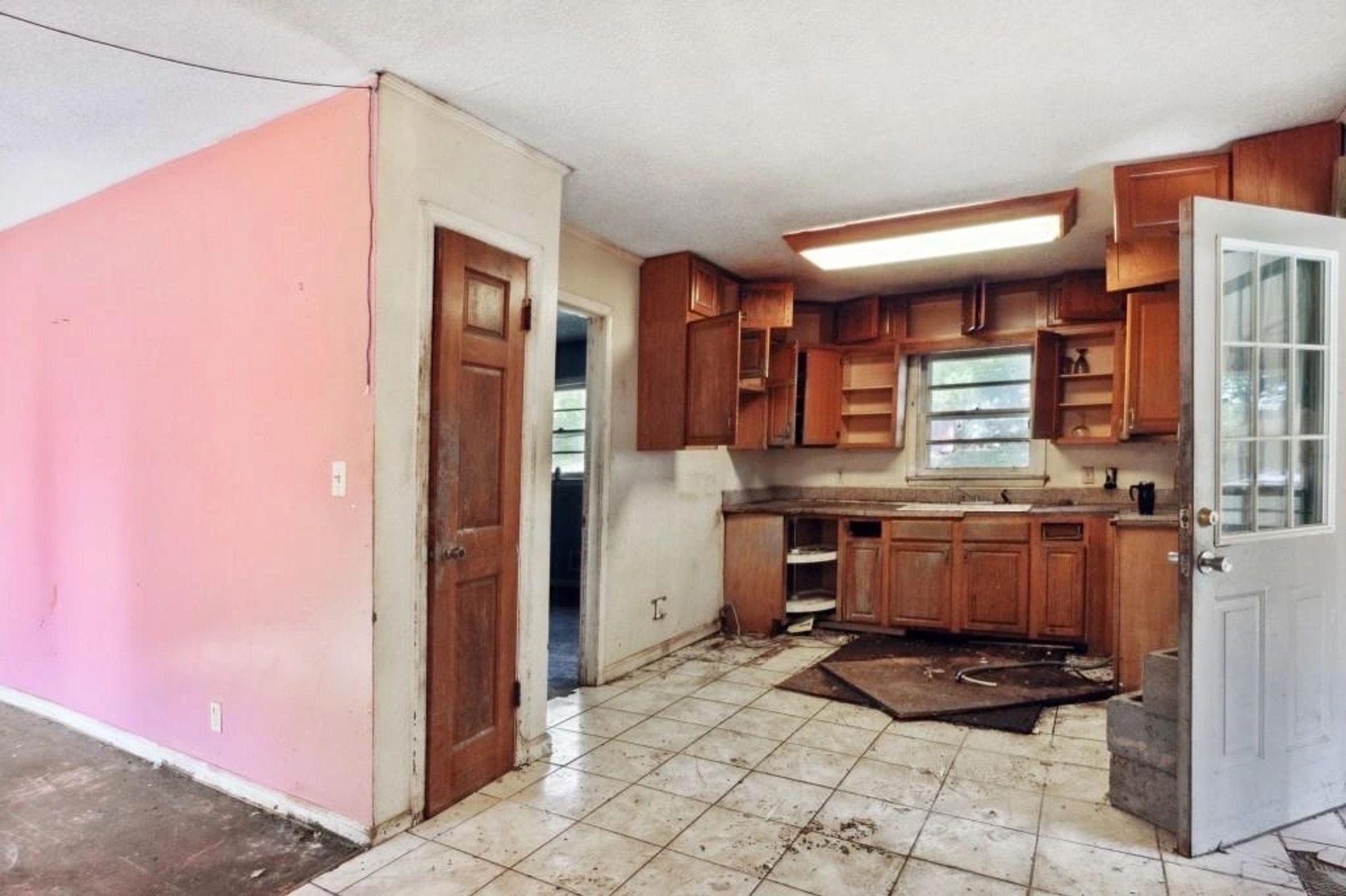 Original kitchen with dated wood cabinetry