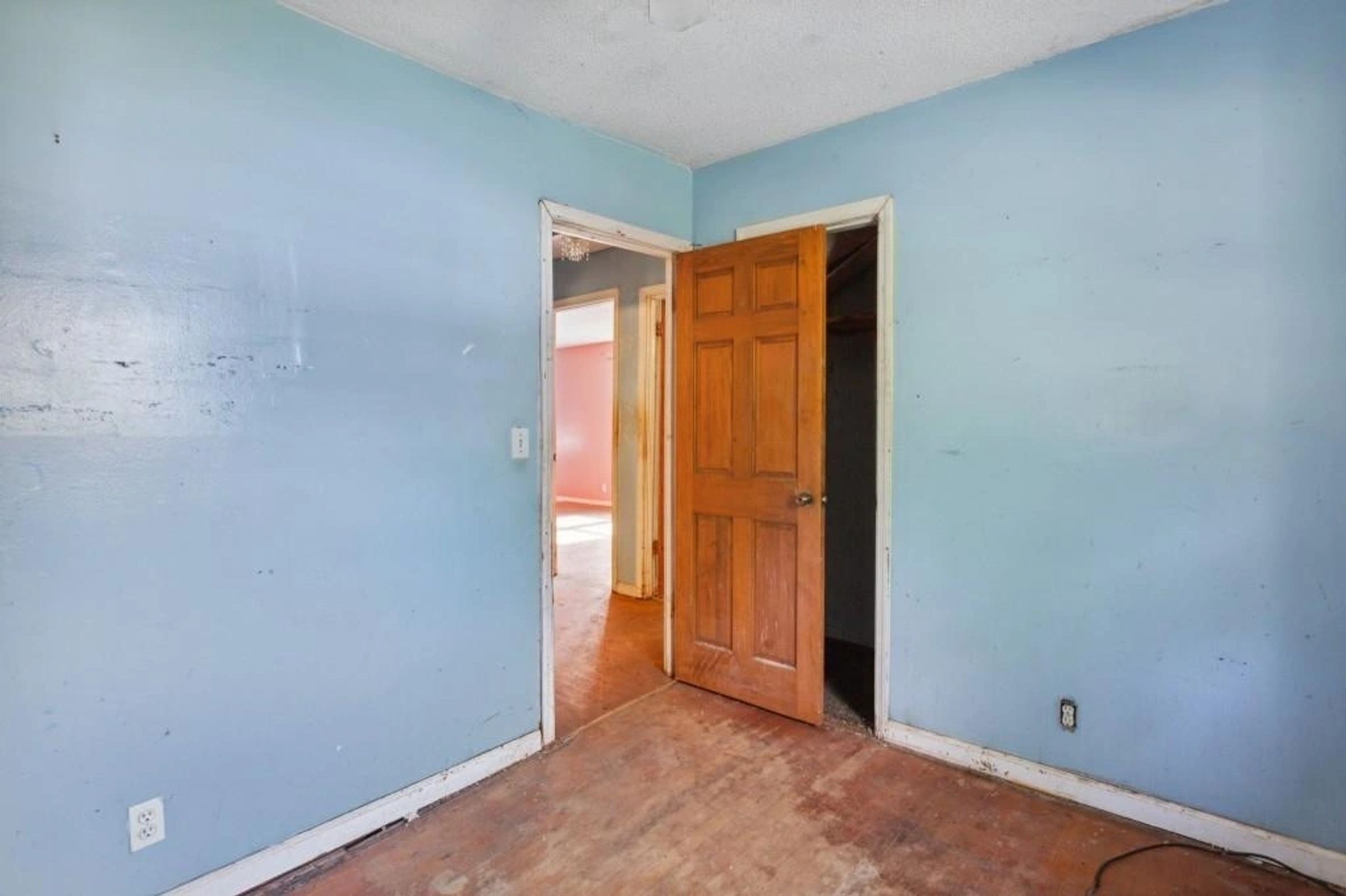 Original blue bedroom with hardwood floors
