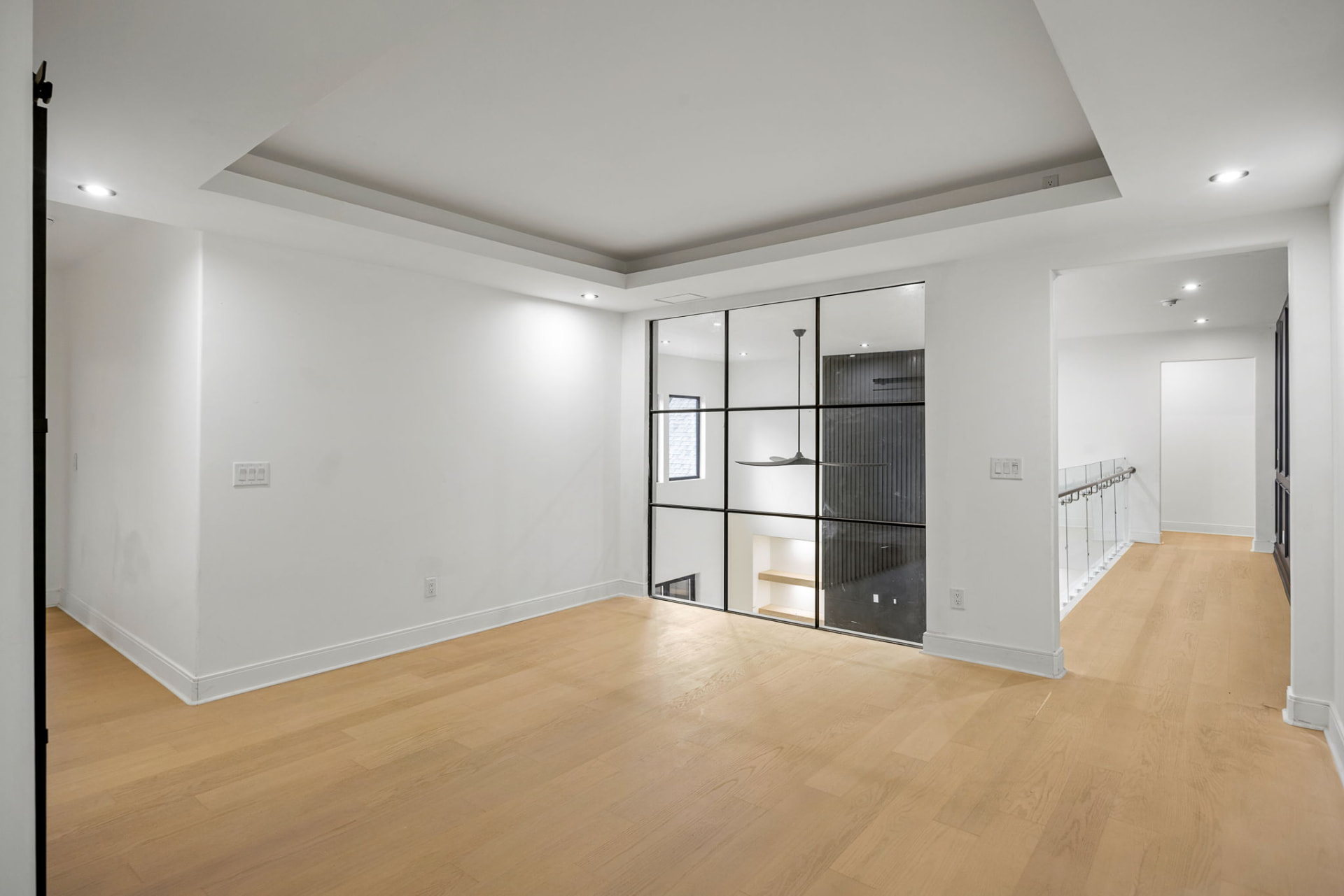 Upper landing with steel-framed interior glass wall