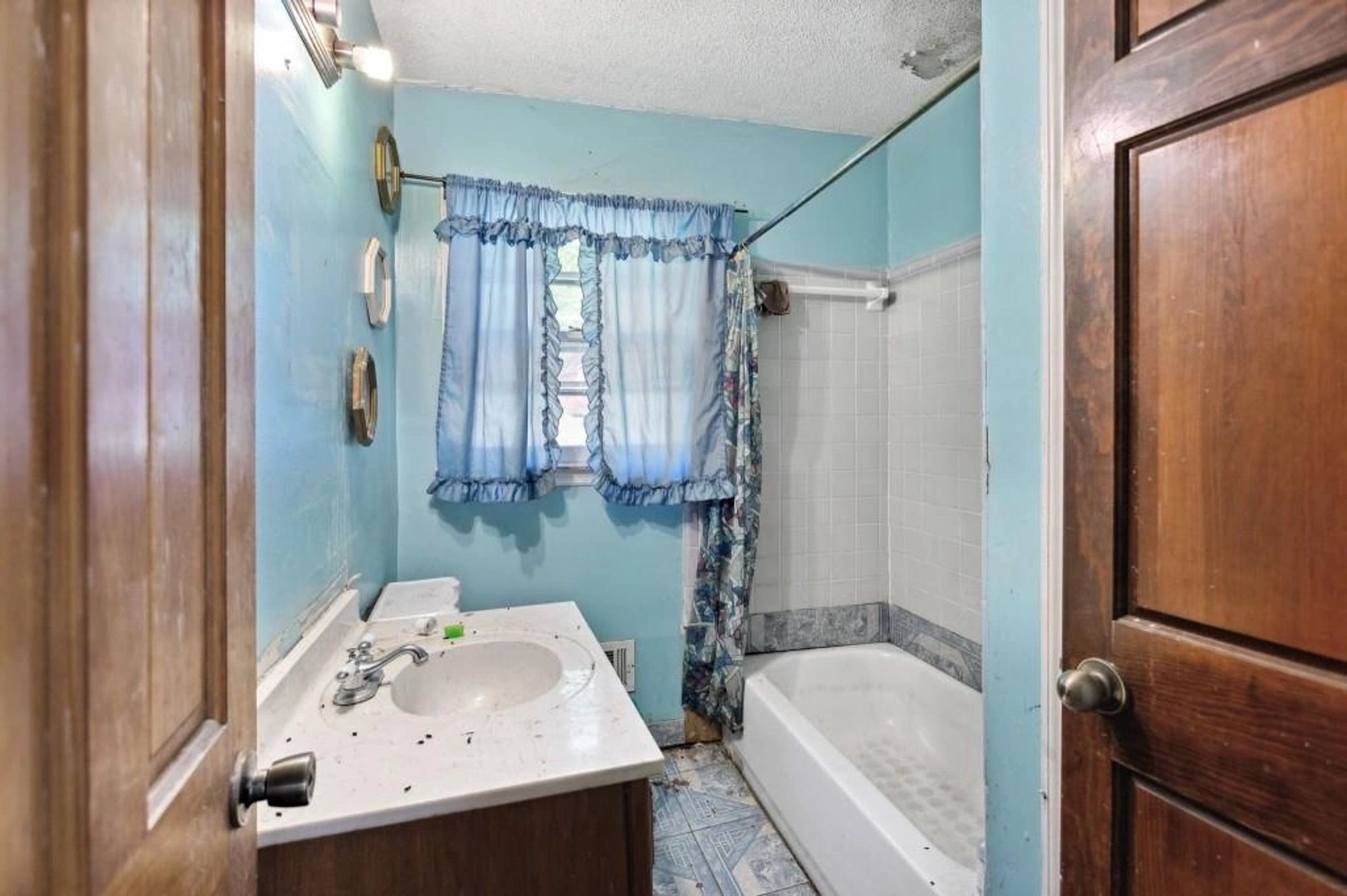 Original hall bath with tub surround